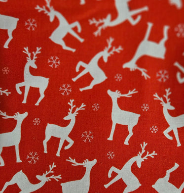 Dog bandana with white reindeer and snowflake pattern