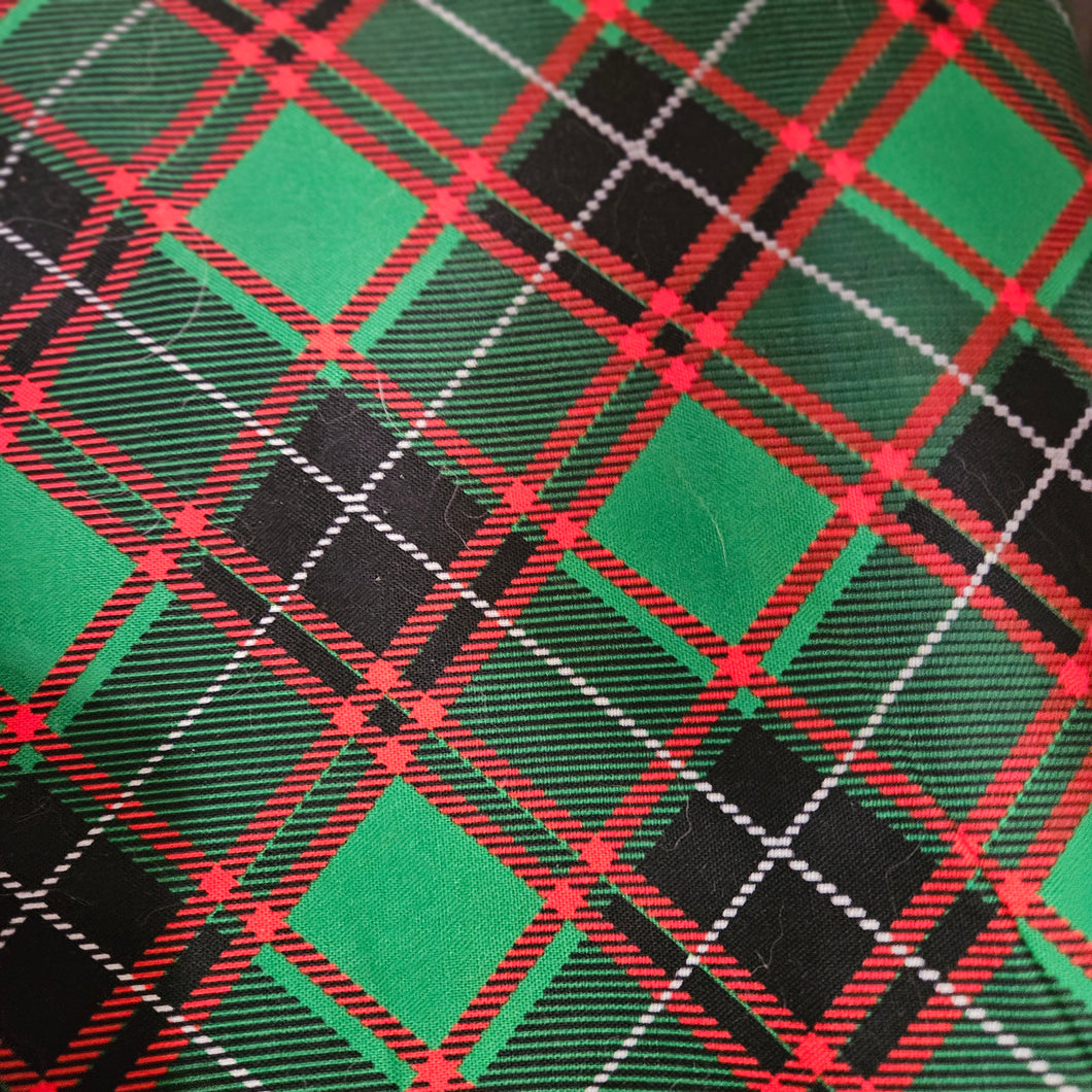 green, black, and red plaid fabric dog bandana